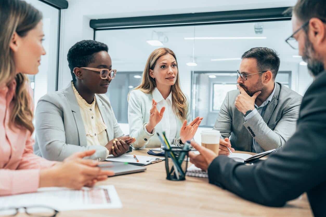 Business Professionals in a Meeting in an Office Discussing Workers Compensation in Calgary, AB