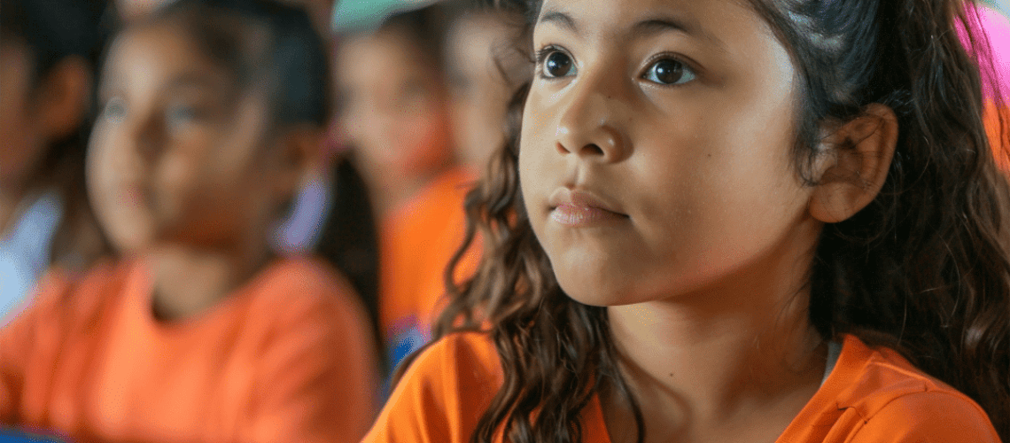 Close-up image of a girl sitting at a lecture in her school in North America